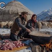 Nomadic Shepherd Couple In Afghanistan Cooking Whole Sheep In Giant Traditional Kazan