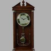 A Classic Pendulum Clock In Oak Wood