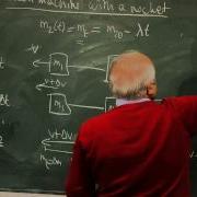 Atwood Machine With A Rocket A Variable Mass Problem