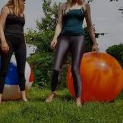 Bouncing Together On The Big Yoga Exercise Ball In The Garden