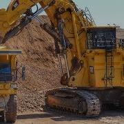 Caterpillar 6060 Face Shovel Loading Autonomous Trucks