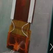 Ultrathin Inchworm Robot Using Electrostatic Film Actuators Climbs Up A Slope