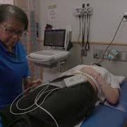 Performing An ECG On A Teenage Girl
