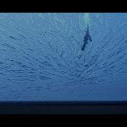 Jack Frost Is Beginning To Melt Away Ice Patterns On A Window Pane