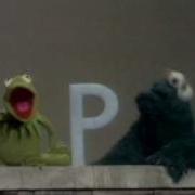 Sesame Street Kermit Shows The Letter B To Cookie Monster