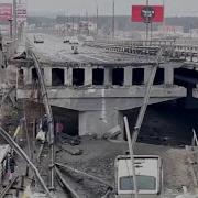 WEB EXTRA People Walk Over Bridge Wreckage In Kyiv Region To Evacuate