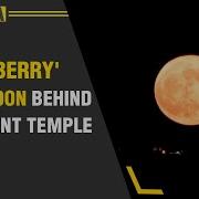 Drone Footage Shows Strawberry Supermoon Behind Ancient Greek Temple