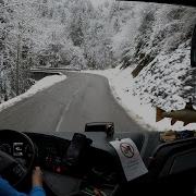 Early Bus Drive To Snowy Mountain In The Alps