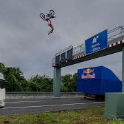 World First Motorbike Flip Between Two Moving Trucks