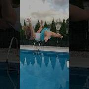 Running And High Dive Jumping Into The Swimming Pool With Clothes On Shorts