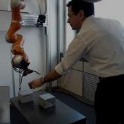Visually Guided Object Tracking And Grasping In Nonmetric Space