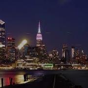 Time Stack Time Lapse Of The Full Moon Rising Behind The Empire State Building And The NYC Skyline