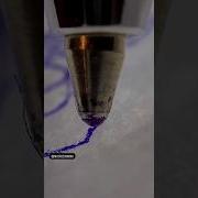 The Ball Of A Pen Loosing Ink While Rolling Over Paper