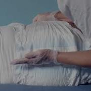 Instructions For How To Put On TENA PROskin Slip Tape On A User Lying Down