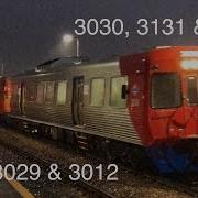 Red Poxboxes Through Islington In The Rain