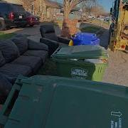Garbage Furnitures Being Picked Up By Garbage Truck 4K Full UHD