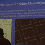Induced Polymorphism Of Liquid Crystal Anchoring At The Nematic Aqueous Interface