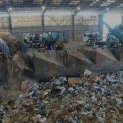 Garbage Trucks Dumping At Transfer Station