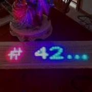 Netduino 60x10 NeoPixel Panel Marquee Scrolling A Transparent Font Over A Rainbow Background