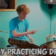 TOMMY PRACTICING DRUMS WITH LOVEJOY